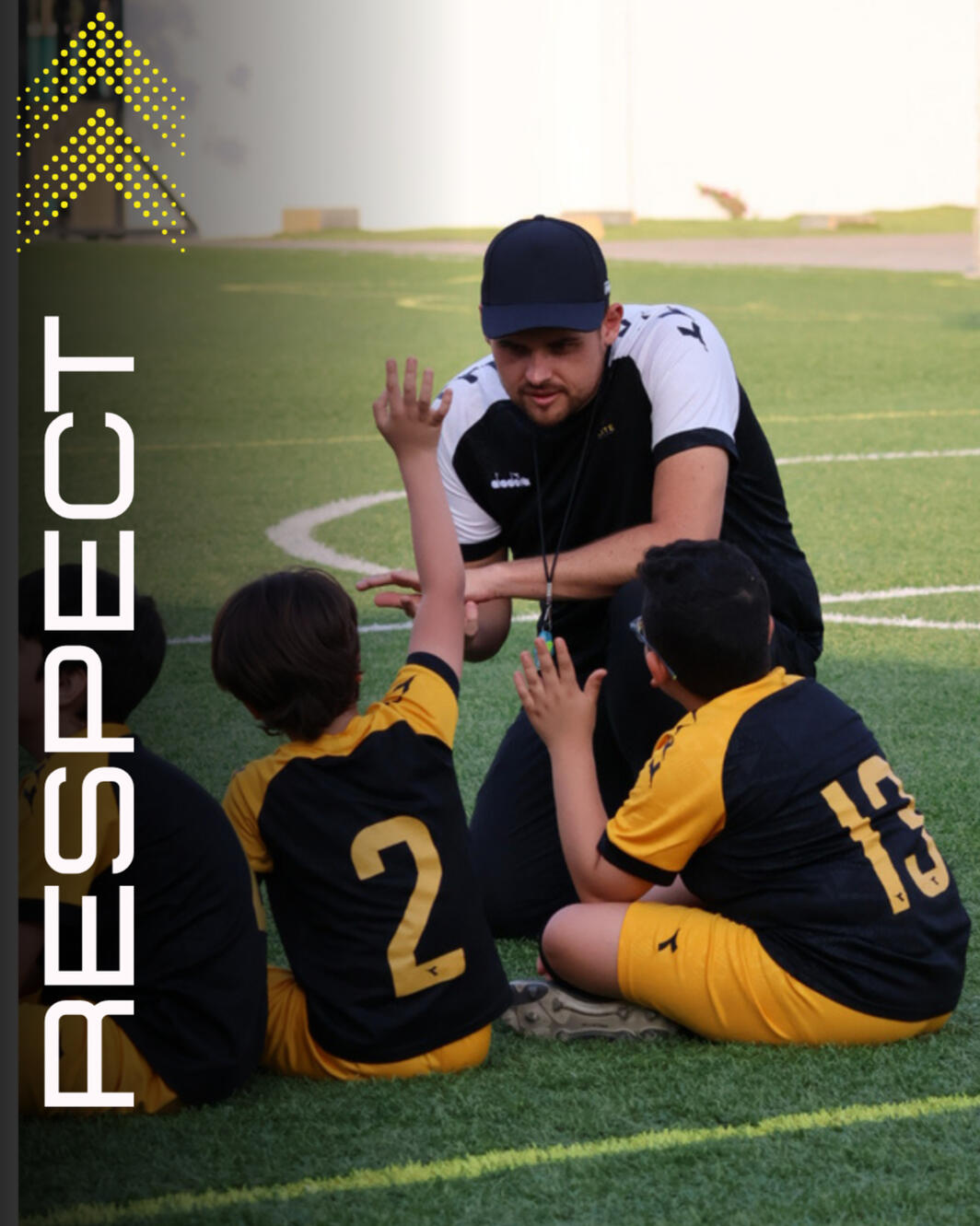 Head coach listening to the young players asking questions